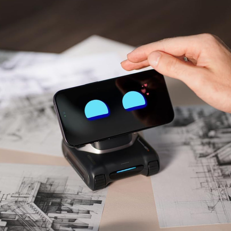 Hand interacting with a smartphone on a stand with blue lights on a architectural drawing background